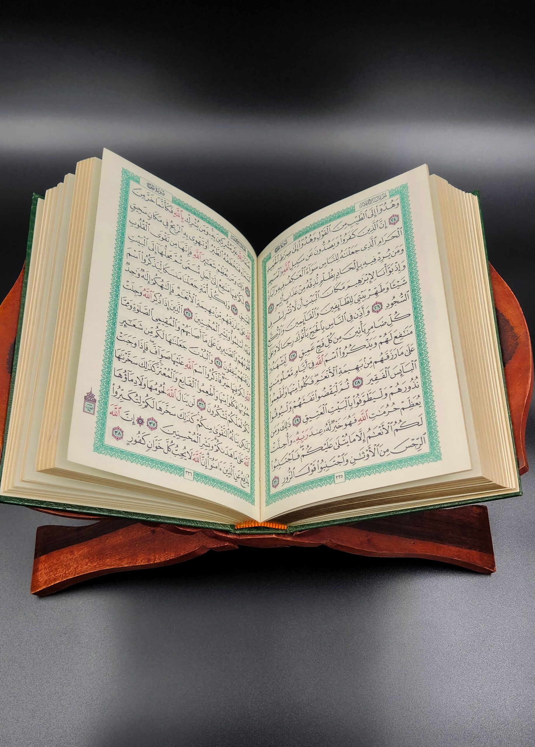 Open Quran displayed on wooden rehal inspiring spiritual reflection and learning.
